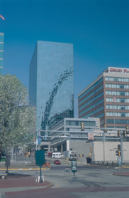 A reflection of the Gateway Arch in another building